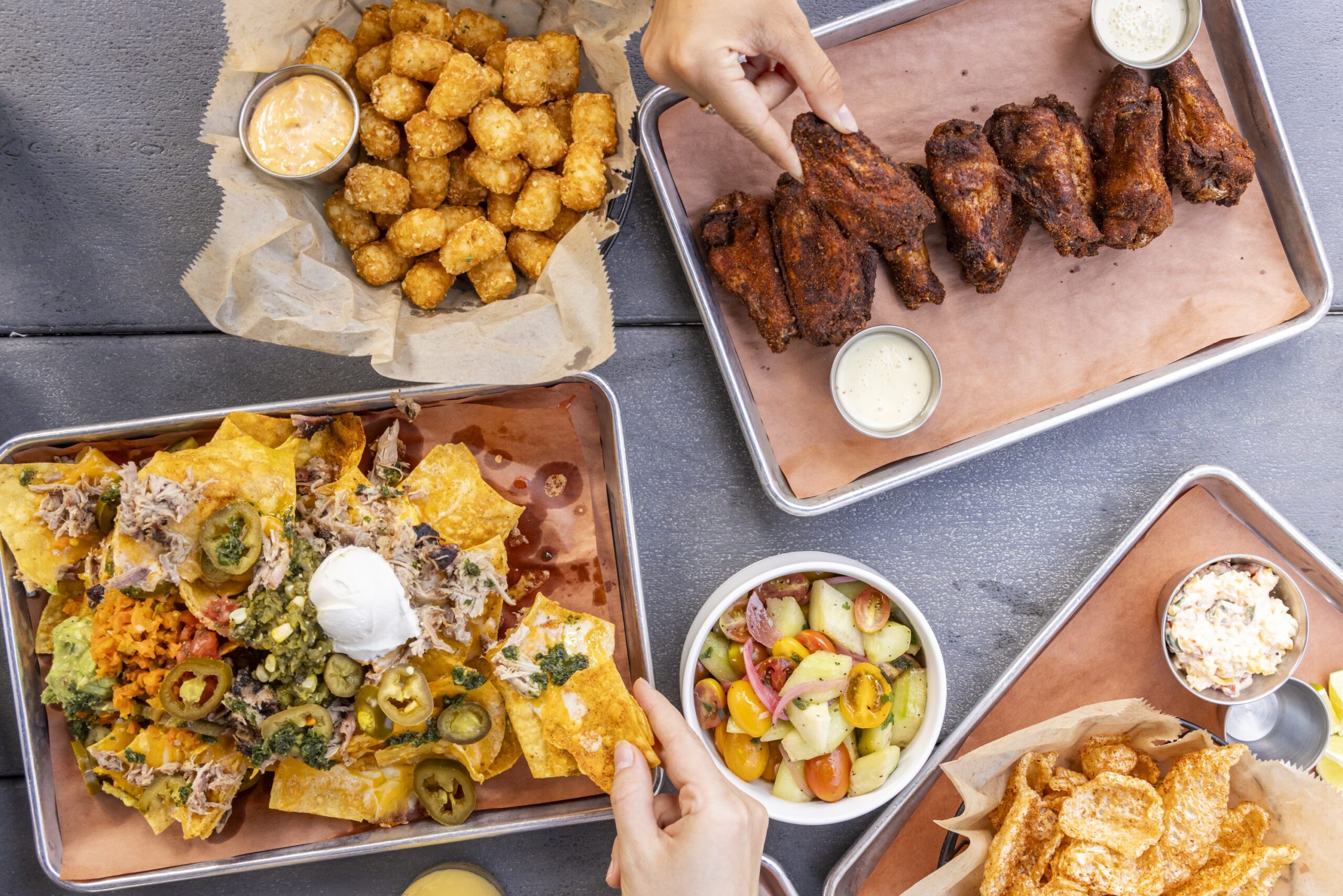Downtown Columbia South Carolina restaurant scene at night with people dining outdoors, showcasing local restaurants and vibrant food culture.